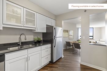 Kitchen, wood flooring available in select homes